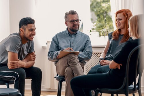 People talk during a group counseling session