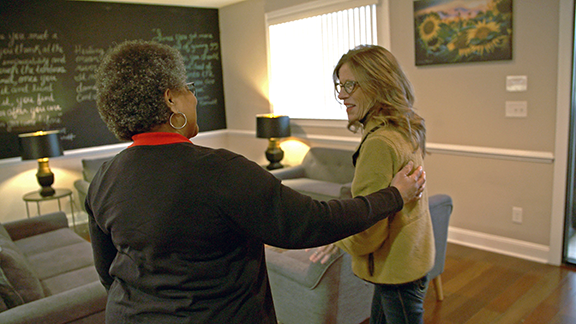 Eleanor member and community recovery partner chat in clinic lobby