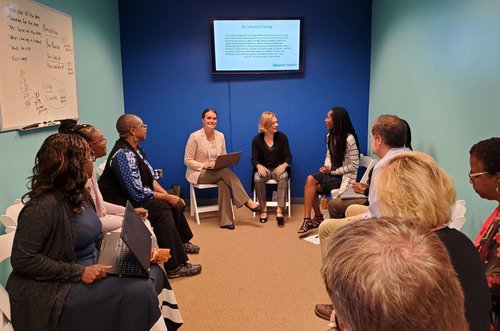 Eleanor Health employees meet for a group discussion