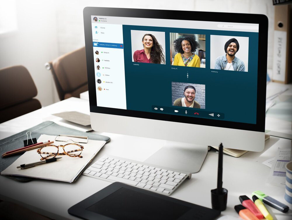 People on a computer screen meeting for a free online support group for people affected by addiction