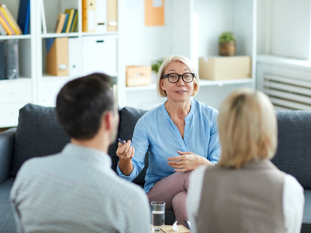 Couple attending therapy session for couples or families affected by addiction