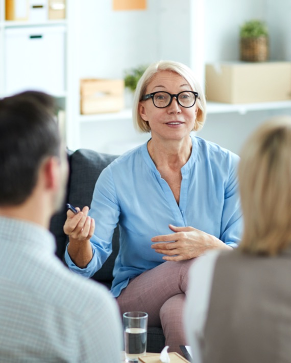Couple attending therapy session for couples or families affected by addiction