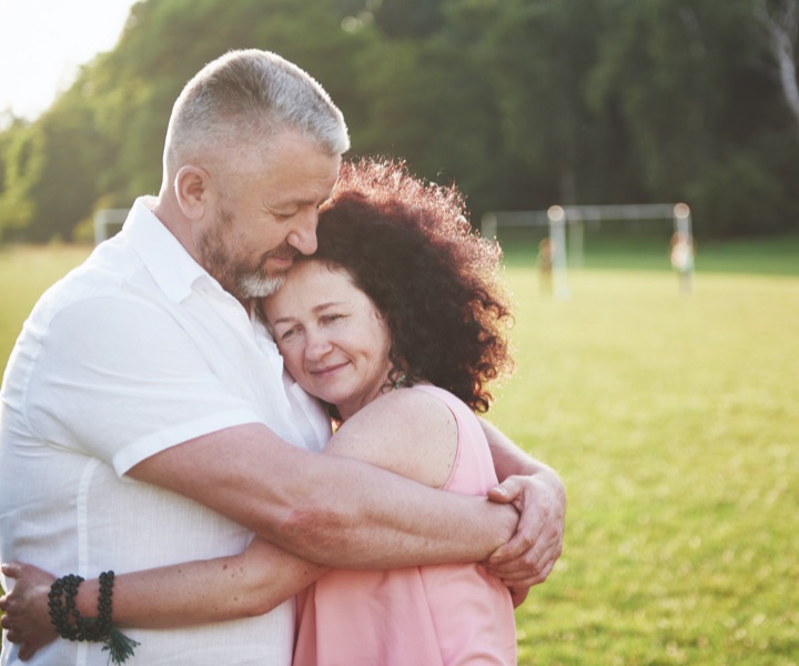 A woman in relapse hugs her partner during recovery