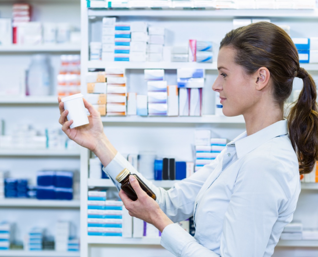 Pharmacist looking at medications for medication-assisted addiction treatment