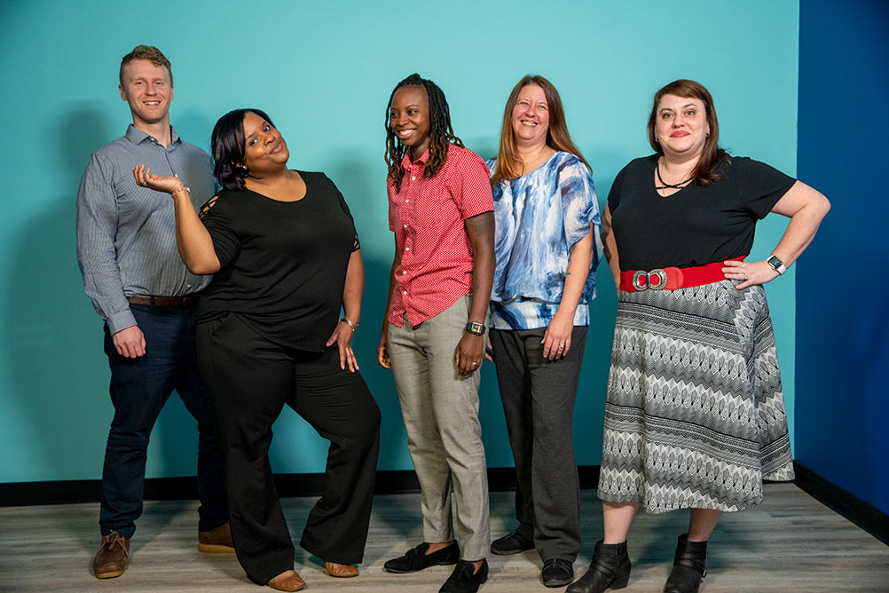 A group of Eleanor Health employees in the North Carolina clinic pose for a fun group photo