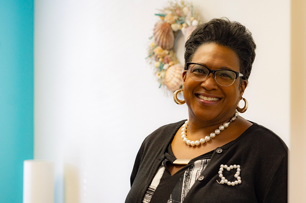 Eleanor Health team member smiles at the camera during the Matthews NC Open House event
