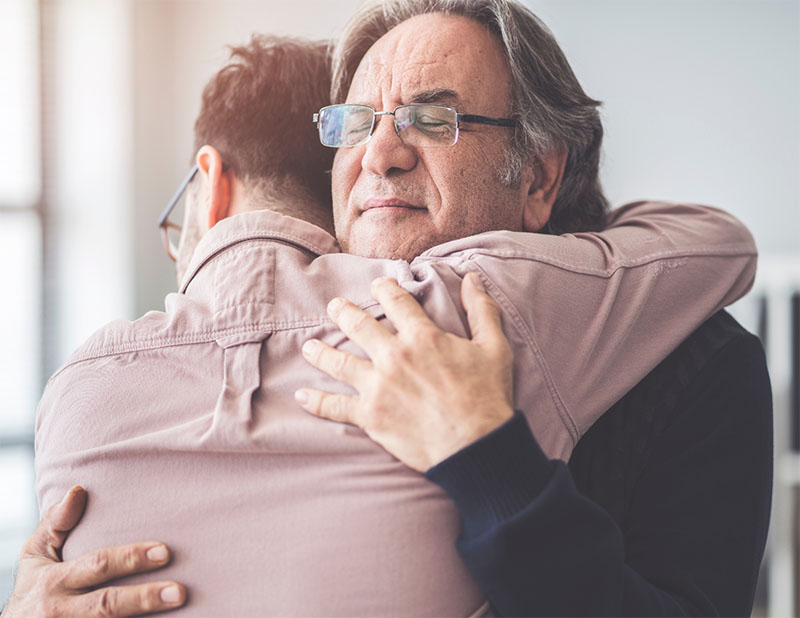 Two people hugging