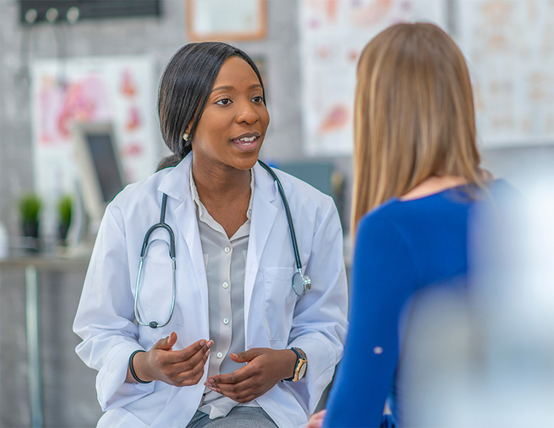 A doctor explaining medication to their patient