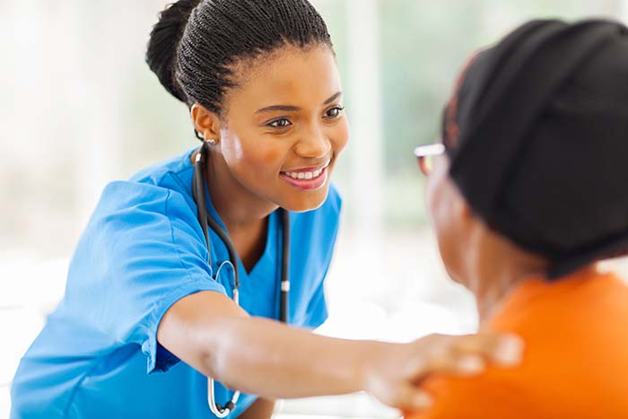 A doctor comforting a woman