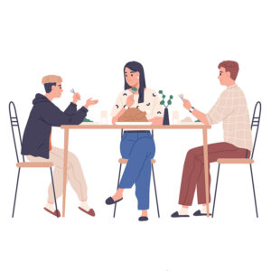 Two parents talk to their child at the dinner table