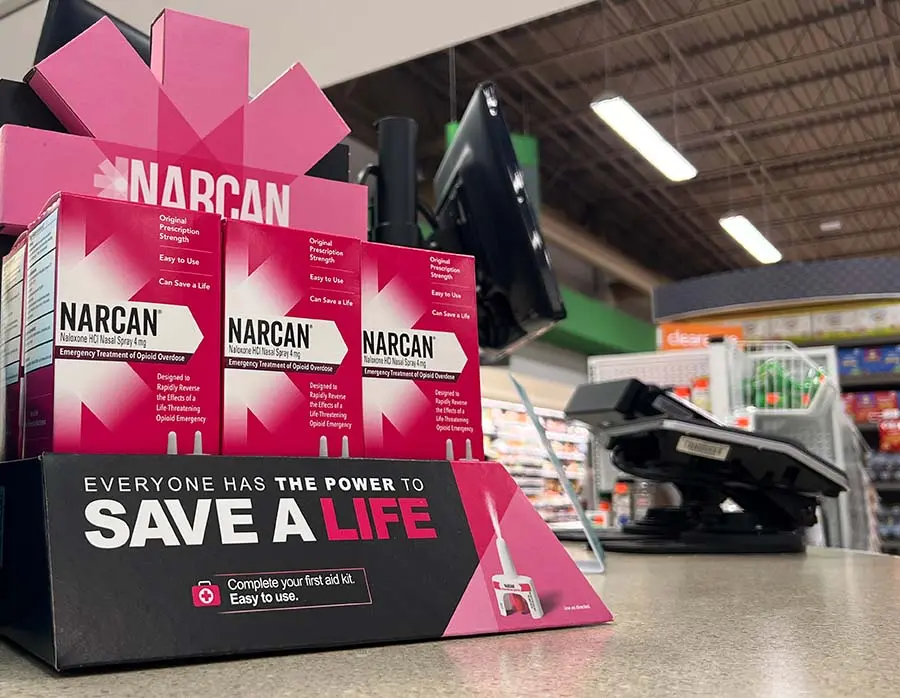 A display of Narcan/Naloxone at a check out counter